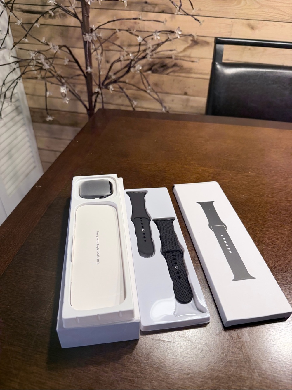 Space Gray smartwatch with two Loop Replacement Bands